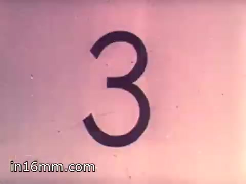 The still features a large, bold number '3' prominently displayed against a light background. This serves as a countdown or indicator, likely used in the context of a promotional film for Air Force Reserve recruiting in 1968, specifically targeting air crews. The visual simplicity and focus on the number suggest an engaging introduction to important content related to the program.