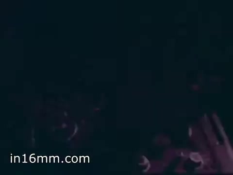 The still from 'Air Force Reserve Recruiting - 1968 - Air Crews' likely depicts a cockpit or interior of an aircraft, capturing elements such as instrument panels and controls. The lighting appears low, emphasizing the operational environment of aircrews. The focus is on the technical aspects of aviation, aimed at showcasing the role and capabilities of the Air Force Reserve.