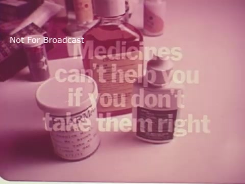 The still features a collection of medicine bottles placed on a surface, prominently displaying the message 'Medicines can't help you if you don't take them right.' This public service announcement emphasizes the importance of proper medication usage. The overall tone is instructive, aiming to raise awareness about the responsibility of patients in adhering to medication guidelines.