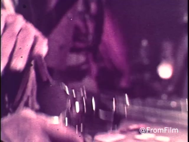 The 16mm still from the 1970s M&M's commercial titled 'Go Fish' features a close-up of a hand interacting with a game, possibly with M&M's candies in view. The imagery conveys a sense of playful competition. The mention of 'for good, clean fun every time' promotes the product's appeal, while the inclusion of a red M&M indicates it predates the 1976 change when orange was introduced to replace red due to health concerns. The overall tone is lively and fun, characteristic of animated commercials from that era.