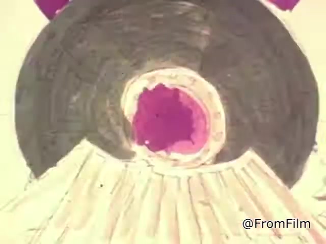 The still from the 1967 'Christmas Seals PSA' features a colorful, stylized representation that appears to highlight the theme of the campaign. The image showcases an abstract design, possibly suggesting a train or festive elements tied to the holiday season, combining vibrant colors with distinct shapes. This visual likely aims to evoke a sense of warmth and community associated with the Christmas Seals initiative, promoting awareness for tuberculosis prevention.   For more insights, follow @FromFilm on Twitter!