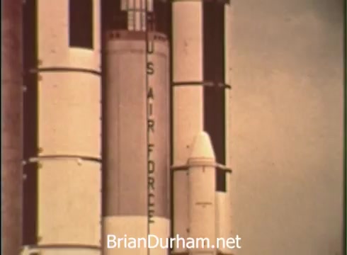 The still from the 1968 USAF Aerospace ROTC PSA features a rocket with prominent 'US AIR FORCE' lettering. The image conveys a sense of ambition and progress, highlighting the connection between military service and aerospace innovation. The tone aligns with the narrative of young individuals pursuing their education while contributing to the Air Force's aerospace initiatives. The rocket symbolizes technological advancement and national service.