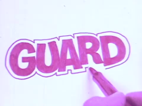 The still features the word 'GUARD' prominently displayed in bold, colorful lettering. A hand, possibly holding a Flair pen, is in the process of completing the letter. The 16mm print gives the image a vintage feel, characteristic of 1970s advertisements. The emphasis on the word conveys the message that the pen features a point guard, enhancing usability. The overall aesthetic captures the playful and vibrant style of that era's commercials.