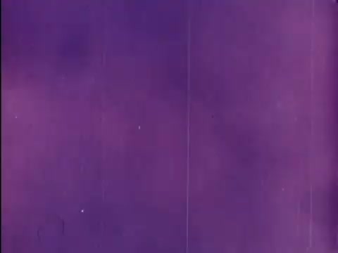 The still features a rich purple background, typical of 16mm film prints, possibly indicating a transition or title card from the 'Rocky and Bullwinkle Show.' Its vibrant color and texture give a vintage feel, reflecting the animation style of the era. It's a snapshot evocative of classic cartoon credits.   Subscribe, like, or follow us on Twitter @FromFilm!