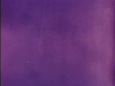 The still showcases a rich, purple background typical of vintage animation. This frame likely serves as part of the credits for the beloved 'Rocky and Bullwinkle' series, capturing the whimsical and colorful essence of the show's titles. The grain and slight imperfections reflect its 16mm film origins, adding to the nostalgic feel.   For more insights, subscribe, like or follow us on Twitter @FromFilm!
