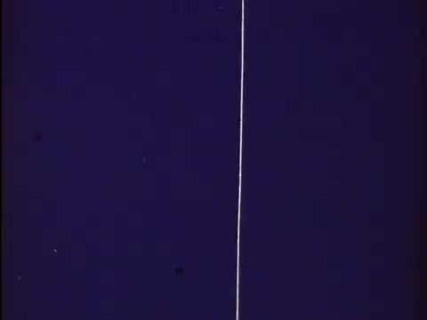 The still features a vibrant purple background with a distinct white line running vertically through the center. This is likely from the title sequence or credits of the 'Rocky and Bullwinkle Show,' characterized by its colorful, playful aesthetic typical of the series. The 16mm format adds a vintage, nostalgic feel to the image.  Subscribe, like or follow us on Twitter @FromFilm.