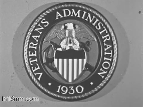 The still features the emblem of the Veterans Administration, prominently displaying a shield with stripes, an eagle, and the text 'VETERANS ADMINISTRATION' along the top and '1930' at the bottom. The design is circular, emphasizing the VA's official identity, likely used in a public service announcement from the 1960s to highlight services for veterans. The overall tone is formal and patriotic.