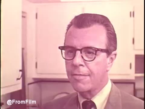The still likely features a middle-aged man with glasses, dressed in a suit, standing in a kitchen setting typical of the 1960s. The overall aesthetic reflects the era's style, with pastel colors and a clean, modern design. This scene captures the essence of the Cold Power Detergent commercial, emphasizing a friendly and confident approach to promoting the product. The focus on household tasks aligns with the advertising trends of the time, appealing to viewers' desire for effective cleaning solutions.   Follow us on Twitter at @FromFilm.