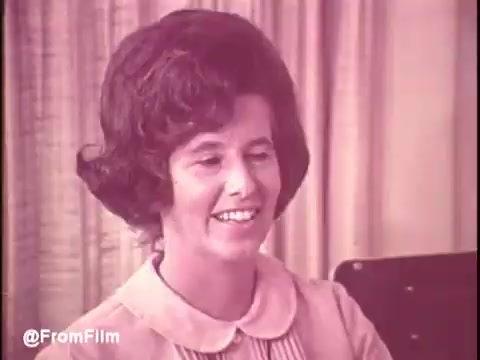 In this still from the 1960s Cold Power Detergent TV commercial, a woman with a stylish bouffant hairstyle smiles warmly while seated. The soft color palette and the background suggest a homey, welcoming atmosphere, typical of that era's marketing aimed at housewives. The cheerful expression likely conveys satisfaction with the product. The overall vibe reflects the nostalgic charm of mid-20th century advertisements.   For more updates, follow @FromFilm on Twitter!