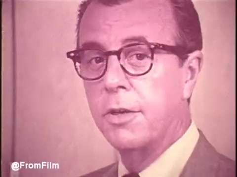 The still from the 'Cold Power Detergent' TV commercial shows a man in a suit and glasses speaking directly to the camera. The color tone is soft and slightly faded, typical of 1960s advertising aesthetics. His expression is earnest, likely conveying a message about the effectiveness of the detergent. The background is simple, emphasizing the speaker and the product's message. Overall, it reflects the promotional style of the era, focusing on personal testimonials and brand trust.   Follow us on Twitter at @FromFilm.