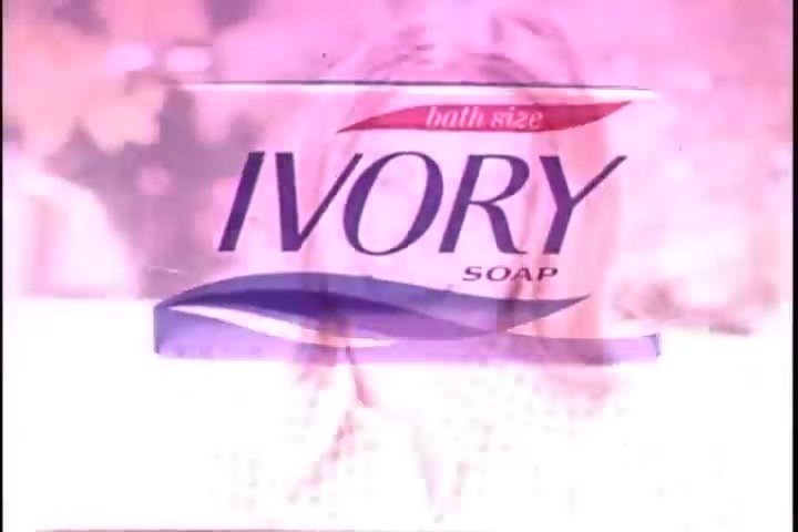 The still shows a vintage advertisement for Ivory Soap, featuring a prominent display of the product's packaging. The text reads 'bath size IVORY SOAP' and is accompanied by a soft, pastel-colored background, which gives it a warm, nostalgic feel. The image likely reflects the marketing aesthetics of the 1970s, emphasizing simplicity and cleanliness associated with the brand.
