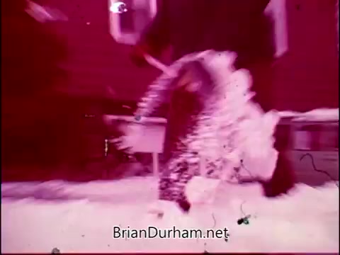 This 16mm still from 'Campbell's Soup - The Manhandlers' features a playful and dynamic scene, likely showcasing a humorous interaction involving soup or its packaging. The vibrant colors and motion hint at a lighthearted atmosphere, complemented by Frankie Laine’s theme song, setting the tone for a fun narrative around Campbell's Soup. The visual style captures the essence of vintage advertising, emphasizing joy and engagement.