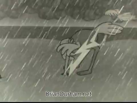 The still depicts a cartoon character in a rainstorm, visibly distressed as it shelters a smaller character beneath its arm. A lightning bolt emphasizes the storm's intensity. The scene conveys a sense of urgency and concern, typical of public service announcements aimed at preparing for disasters.