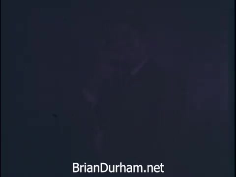 The still from the 'Niagara Rolla-ssage chair commercial' (1968) conveys a sense of urgency and professionalism. It likely features a business environment where calls and decisions are being made rapidly. The voiceover highlights the value of self-care for busy individuals and promotes the Niagara Rolla-ssage chair as a solution for comfort and relaxation. The imagery suggests a focus on the importance of well-being amid a fast-paced work life.