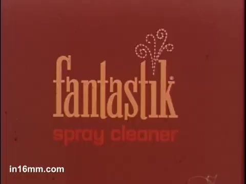 The still features the logo of 'fantastik spray cleaner' prominently displayed against a red background. The design includes decorative elements, conveying a vibrant and catchy aesthetic typical of commercial branding. The text is bold and playful, emphasizing the product's name and its purpose as a cleaner.