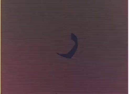 The 16mm still features a stylized graphic element set against a muted color background. The design appears abstract, likely intended for animation or title sequences, indicative of the creative experimentation typical in B-roll footage from the 1980s. The film is associated with Tee Collins and relates to 'Sesame Street Arab,' suggesting a cultural context in animation. The overall aesthetic reflects the era's visual trends.