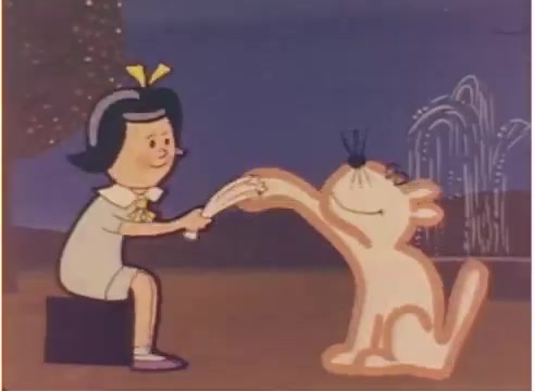 The still features a young girl with black hair and a yellow bow, joyfully interacting with a cartoonish white cat. They appear to be playing together in a whimsical setting, marked by muted colors and simple, charming backgrounds typical of 1980s animation. The scene evokes a sense of innocence and playful companionship.