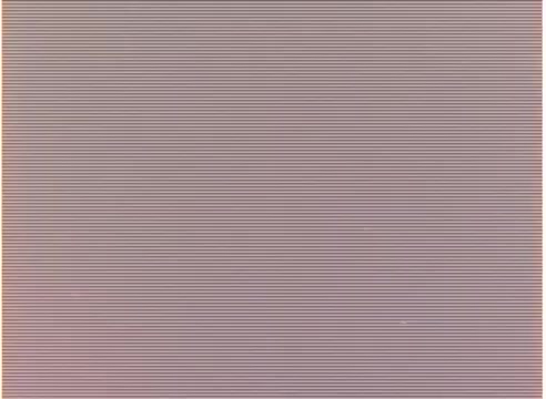 The still is a 16mm negative displaying a consistent pattern of horizontal lines, typical of film strip characteristics. There are no identifiable images or details present, suggesting it may represent a blank or damaged section of the b-roll.