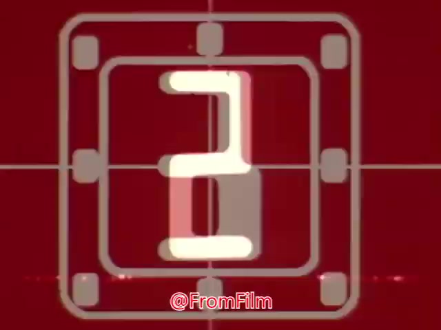 The still appears to be a countdown screen from a 16mm film, likely indicating the start of an animation. The red background and large white number suggest a retro aesthetic commonly used in mid-20th century advertising or animation. This could be part of an animated short designed to capture attention, possibly related to a product or service in the context of a coffee break. The exact nature of the animation or advertisement is unclear without additional footage.