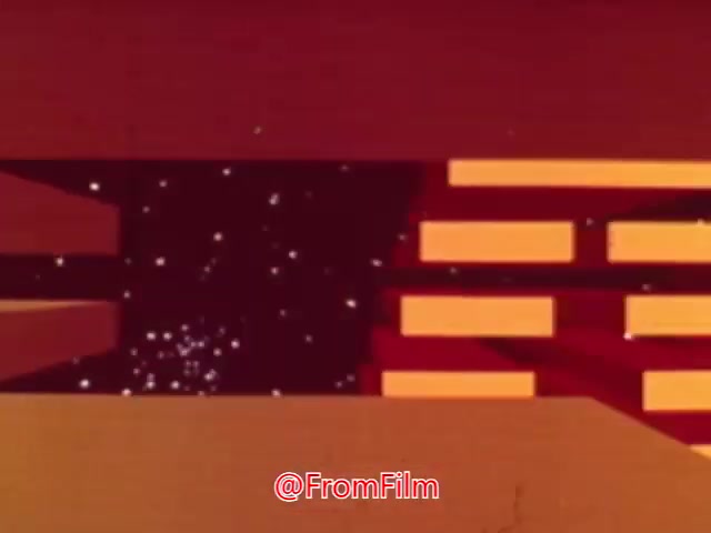 The still from 'Coffee Break' appears to feature a vibrant, abstract animation with geometric shapes and a dynamic color palette, primarily comprising earthy reds and yellows. The animation seems to evoke a sense of motion and fluidity, potentially illustrating themes related to relaxation or a pause. Its exact purpose and the specific product or service it advertises remain unclear, but it likely promotes something associated with taking a break or enjoying a beverage. The style is reminiscent of experimental animations often seen in mid-20th-century advertising.