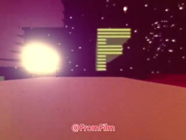 The still from 'Coffee Break' features a surreal, abstract animation with vibrant colors and geometric shapes. The scene includes a luminescent light source and digital motifs, creating a whimsical, dreamlike atmosphere. It’s likely a creative visual piece, possibly intended to promote relaxation or caffeine consumption, though the specific context remains unclear.