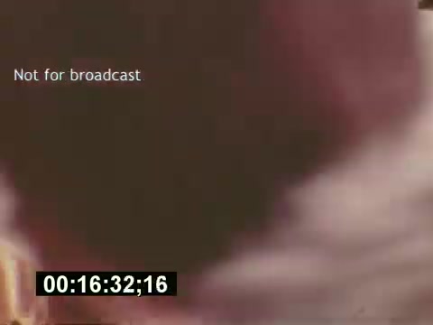 The still from 'Sixty Second Spot' features behind-the-scenes footage from the creation of a 7-Up commercial, illustrating the process from script development to casting and filming. The frame indicates it's not for broadcast, and the timecode suggests a specific moment in the film. The overall context provides insight into mid-1970s advertising techniques and production.