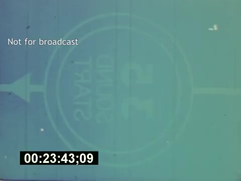 The still from 'Sixty Second Spot' showcases a frame that appears with a countdown mechanism, likely indicating the preparation for a commercial shoot. The text 'Not for broadcast' suggests this is behind-the-scenes footage. The timecode at the bottom may signify a specific point in the film, focusing on the production process of a 7-Up commercial from script development through casting and filming. The overall aesthetic and format are characteristic of mid-1970s film production techniques, capturing a moment of anticipation in the creative process.