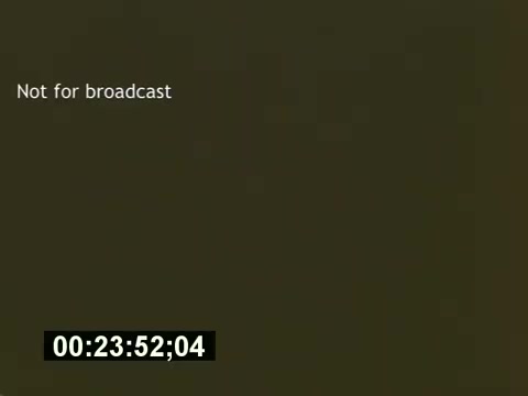 The still features a simple text overlay stating 'Not for broadcast,' indicating that it is likely a behind-the-scenes glimpse from the film 'Sixty Second Spot,' which explores the process of creating a 7-Up commercial. The timestamp suggests it's a snippet from the film, captured on 16mm film stock, with a focus on the production aspects, including scripting, casting, and filming. This context highlights the informative and nostalgic nature of the piece regarding 1970s advertising.