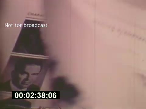 The still from 'Sixty Second Spot' depicts a behind-the-scenes look at the creation of a 7-Up commercial from the mid-1970s. It features images likely related to casting and script development, highlighting the process and artistry involved in commercial filmmaking during that era. The timestamp suggests it comes from a specific moment in the film, underscoring its documentary nature and the emphasis on the creative journey behind advertising. This piece captures a unique moment in the evolution of media production.