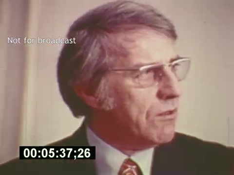 The still from 'Sixty Second Spot' features a man in formal attire, likely discussing the creative process behind a 7-Up commercial from the mid-1970s. It captures a moment of articulation in a documentary-style format, highlighting elements like scriptwriting, casting, and filming. The text 'Not for broadcast' indicates it’s a behind-the-scenes look, contributing to an educational exploration of advertising production.