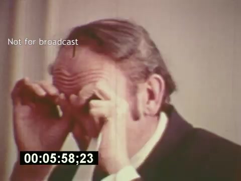 The still from 'Sixty Second Spot' depicts a man adjusting his glasses, suggesting a moment of scrutiny or focus. The scene likely captures a behind-the-scenes aspect of the commercial creation process, emphasizing the attention to detail involved in filmmaking. With a timestamp indicating 5 minutes and 58 seconds, it might represent a pivotal moment in the documentary, showcasing the intricacies of producing a 7-Up commercial from conception to filming. The 'Not for broadcast' label hints at its use in a non-public context, adding to its unique value.