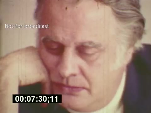 The still from 'Sixty Second Spot' captures a moment focused on a man deep in thought, likely involved in the creative process behind a 7-Up commercial. The mid-1970s aesthetic is evident in the film's quality and coloring, illustrating the behind-the-scenes journey from scriptwriting to casting and filming. The text 'Not for broadcast' suggests this is a private or preliminary view of the filmmaking process. It offers a glimpse into the labor and contemplation that go into creating an effective advertising piece.