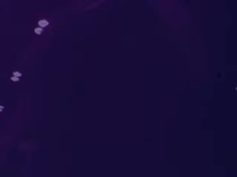 The still from the animated M&M's commercial features a dynamic basketball theme. It likely showcases the colorful M&M's characters engaged in fun and playful antics related to basketball, emphasizing humor and lightheartedness typical of M&M's advertising. The setting may include elements of a basketball court or playful interactions between the candies.