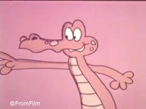 The still features a whimsical, cartoon-like alligator character with a friendly expression, set against a solid pink background. The alligator has exaggerated features, including large eyes and a wide smile, embodying a playful tone typical of 1970s advertising. This style captures the lighthearted charm of the era, likely promoting Baggies Storage Bags in a fun and engaging way.   .