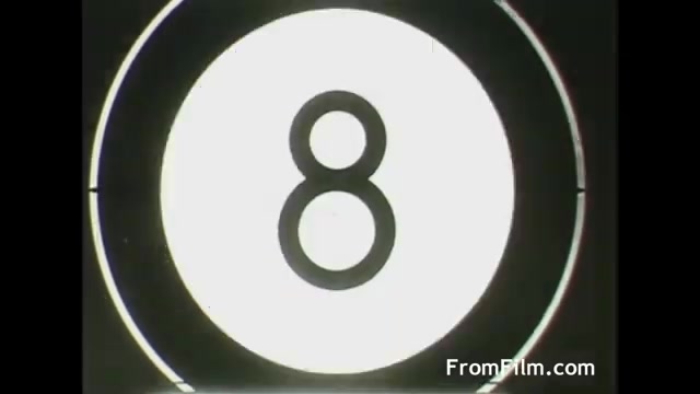 The image shows a film countdown indicator displaying the number '8' on a plain white background. It's framed with a circular outline, typical of film countdowns used in vintage projections. The aesthetic is representative of mid-20th century film techniques.