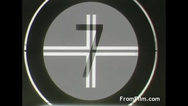 The still features a circular countdown graphic showing the number '7' in the center, surrounded by a design of intersecting lines. The overall aesthetic is reminiscent of mid-20th-century film technology, likely indicating the start of a film reel or commercial, specifically for the 1958 UPA Tang commercial. The style reflects the visual design trends of that era.