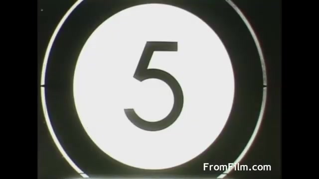 The image is a still from the 1958 UPA Tang commercial, featuring a large white circle with a bold black number '5' in the center. The circle is outlined by a thin black border, and there are indications of a historical film countdown, typical of the era's commercial production style. The overall composition suggests a focus on transition or beginning, characteristic of film countdown sequences.
