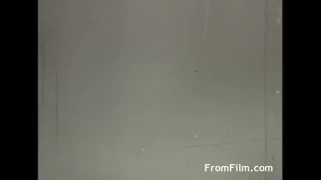 The still from the 1958 UPA Tang commercial features a plain, muted background. There are indications of film grain and slight imperfections, typical of the era's 16mm film. The composition is likely intended to focus on an animated product or character, though specific details are not visible in this frame. Overall, it conveys a nostalgic feel characteristic of mid-20th century advertising.