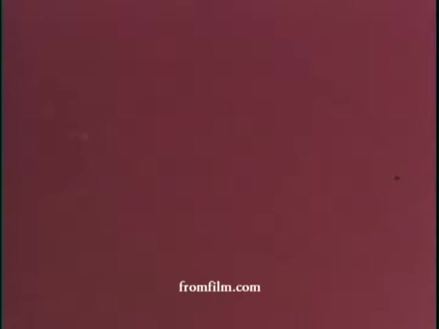 The still from the 16mm print of the WCBS promo for Chris Borgen features a solid burgundy background. The image appears to be a simple color field, possibly with a slight texture or grain indicative of vintage film stock. The watermark 'fromfilm.com' is visible at the bottom. There are no identifiable figures or scenes present in this particular still.