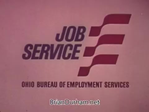 The still features the logo of 'Job Service Ohio,' prominently displayed in bold lettering. Below the main title, the text reads 'Ohio Bureau of Employment Services.' The design utilizes a simple, clean aesthetic with strong graphic elements, likely aimed at conveying professionalism and accessibility in employment services. The color palette appears muted, reflecting a vintage style typical of 16mm film.