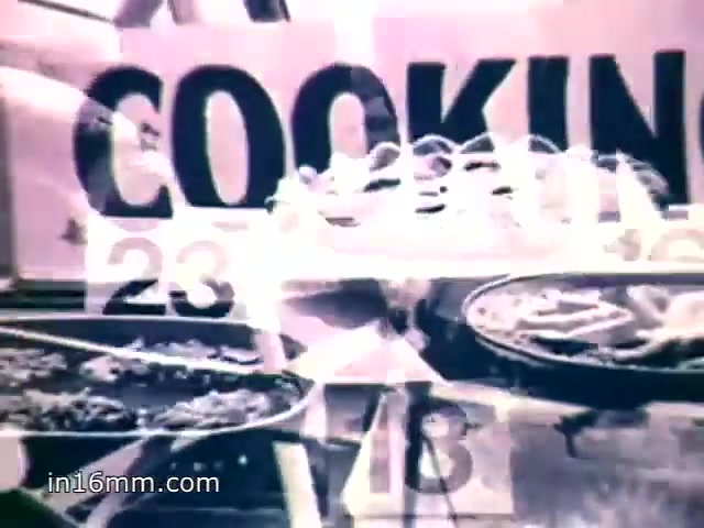 The still features a nostalgic 1970s cooking scene emphasizing Mueller's Old Fashioned Egg Noodles. The voiceover highlights the long-standing tradition of awarding cooking prizes at local county fairs, noting the popularity of dishes made with Mueller's noodles. The visual elements, including plates of food and a prominent 'COOKING' sign, underscore the brand's appeal and the superior taste that keeps people coming back for more.