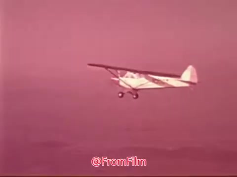 The still features a small aircraft flying through a pastel-colored sky, likely during sunset or dawn. It captures a moment from a Public Service Announcement about the Civil Air Patrol, highlighting aviation and perhaps the organization's mission. The image evokes a sense of adventure and community service.