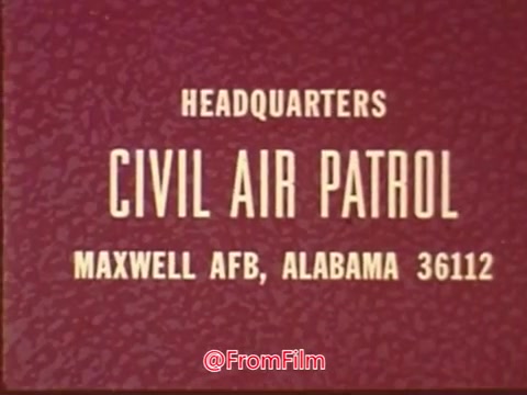 The still features a text slide from a Civil Air Patrol public service announcement, identifying the headquarters location as Maxwell Air Force Base in Alabama, with a zip code of 36112. The background has a textured appearance, and the text is prominently displayed in a simple, bold font. The overall presentation emphasizes the official nature of the Civil Air Patrol organization.