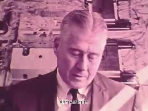 The still from the 1960s 'Prevent Blindness PSA' features a middle-aged man in a formal suit, with a focused expression as he listens or reflects. The background appears to have medical or eye examination equipment, suggesting a context related to vision health. The conversation highlights personal experiences with eye health issues, emphasizing the importance of eye exams and the potential impact of conditions like glaucoma.