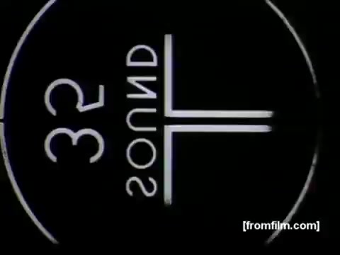 The still features a vintage 16mm film frame from the animated commercial 'See About a Kitchen Phone' produced by UPA for Bell Telephone in 1958. It displays a stylized graphic design typical of the era, with a focus on minimalism and bold typography. The text reads '32 SOUND,' indicating the audio format, surrounded by a circular design. This encapsulates the aesthetic of late 1950s advertising while highlighting the integration of technology into everyday life, specifically in the kitchen.