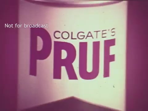 The still features a vintage 16mm print of a commercial for Colgate's Pruf spray starch, showcasing the product prominently. The design includes bold typography with the word 'PRUF' highlighted, emphasizing its branding. The color palette is muted, typical of the 1960s aesthetic, and the text indicates it's not intended for broadcast. The overall look captures the essence of mid-century advertising.