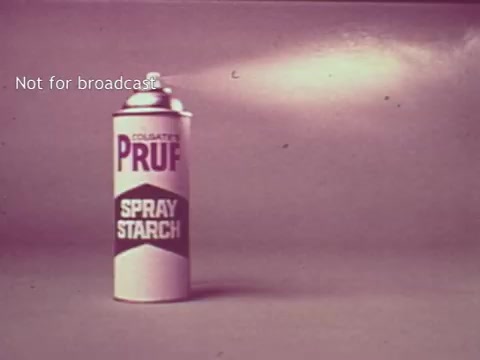 The still features a can of 'Pruf Spray Starch,' prominently displayed against a simple background. The can is designed with bold text, emphasizing its brand name and purpose. A spray nozzle at the top indicates that it's an aerosol product. The overall aesthetic reflects the advertising style of the 1960s, focusing on clarity and straightforward presentation. The text 'Not for broadcast' suggests it is intended for archival or private viewing rather than commercial use.