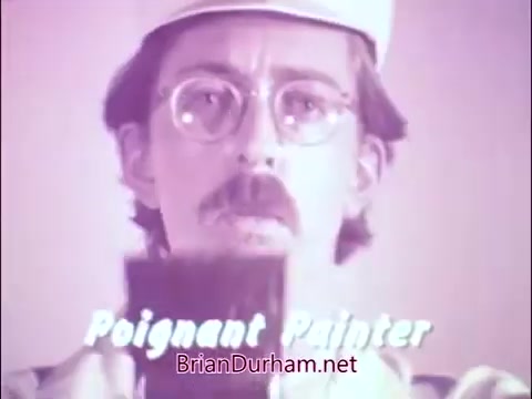 The still features James Noble, known for his role in 'Benson,' portrayed as the 'Sad Commuter.' The PSA, from the 60s/70s, emphasizes the importance of addressing tuberculosis and respiratory illnesses, reflecting the National Tuberculosis and Respiratory Disease Association's mission before its name change to the American Lung Association in 1973. The tone is somber, underlining the health challenges faced in that era.