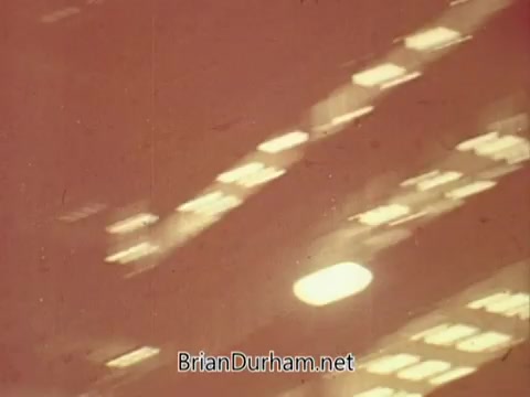 The still from the 1967 PSA by the National Council on Alcoholism features a blurry, abstract composition with light reflections and shapes. The warm tones suggest a somber atmosphere, likely aimed at conveying a serious message about alcohol awareness. The indistinct visual style may evoke feelings of confusion or disorientation, aligning with the theme of the impacts of alcohol.