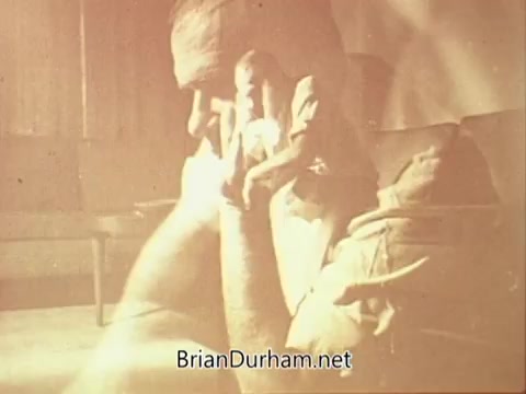 The still from the 1967 National Council on Alcoholism PSA displays a somber, introspective scene. It appears to feature an individual deep in thought, possibly reflecting on the struggles associated with alcoholism. The lighting and focus contribute to a sense of melancholy, emphasizing the serious emotional impact of the subject matter. The overall mood is one of contemplation and concern, relevant to the PSA's message about alcohol addiction.